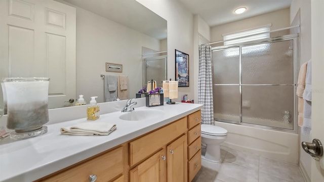 full bathroom featuring toilet, tile patterned flooring, enclosed tub / shower combo, and vanity