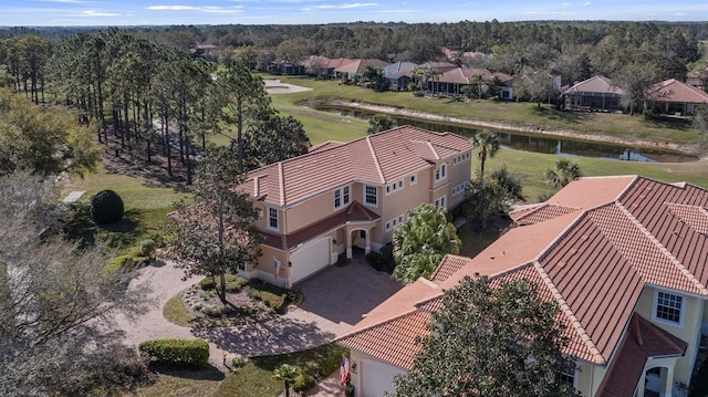 birds eye view of property with a residential view and a water view