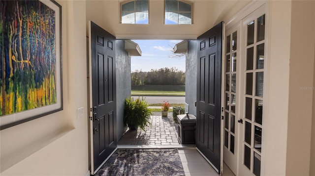 entrance foyer featuring tile patterned flooring