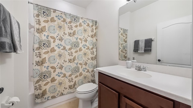 bathroom with shower / tub combo, vanity, and toilet