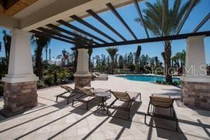 view of patio / terrace featuring a community pool