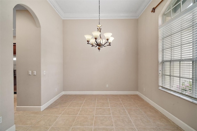 empty room featuring arched walkways, crown molding, light tile patterned floors, an inviting chandelier, and baseboards