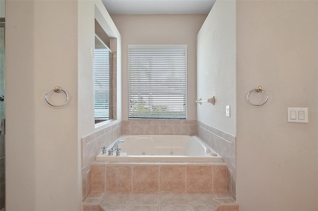 full bath featuring a jetted tub