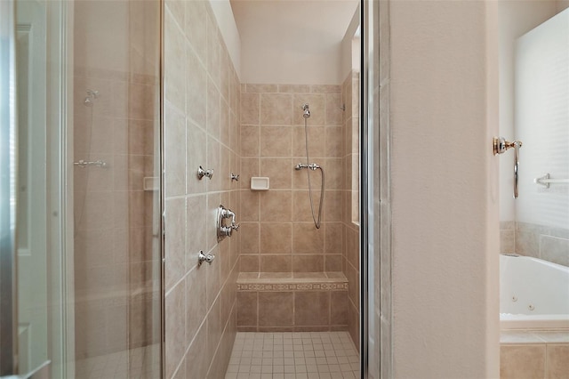 bathroom featuring a whirlpool tub and a stall shower