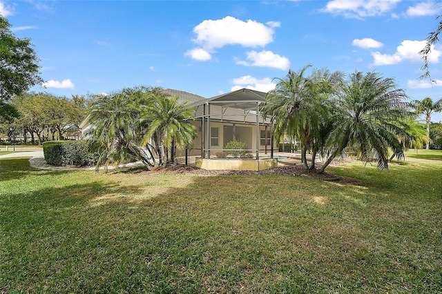 view of yard featuring a lanai and an outdoor pool