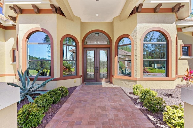 view of exterior entry featuring french doors