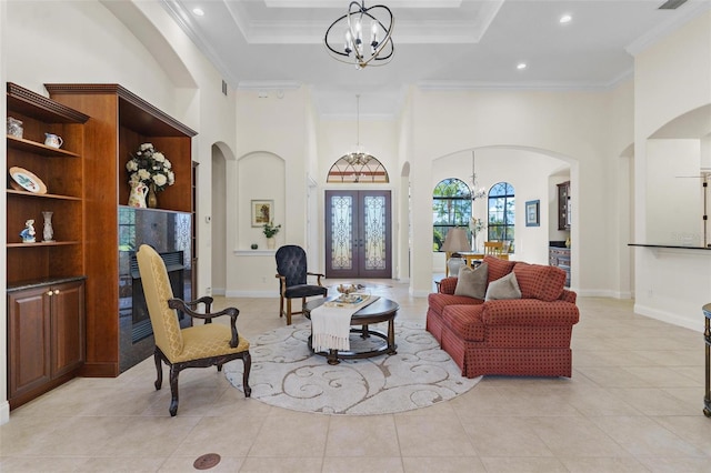 living room featuring crown molding, light tile patterned floors, french doors, and a chandelier