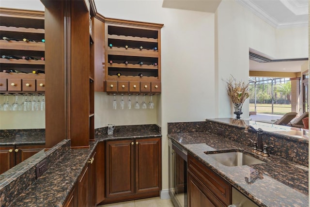 bar with beverage cooler, ornamental molding, wet bar, and a sink