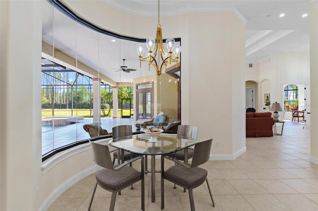 tiled dining space with crown molding, baseboards, a high ceiling, an inviting chandelier, and a sunroom