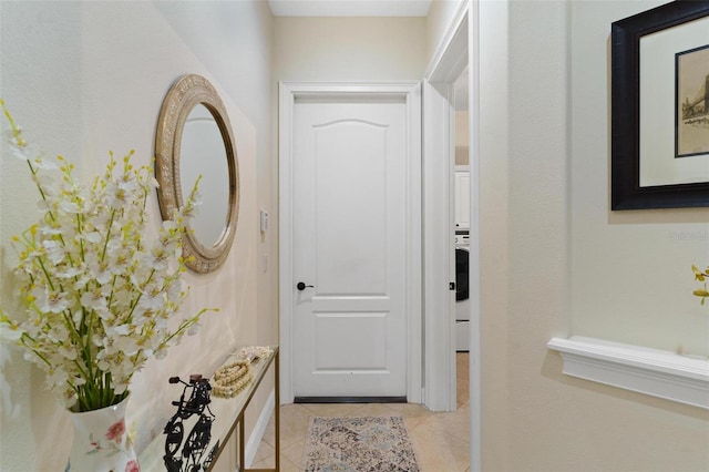 doorway to outside with light tile patterned flooring