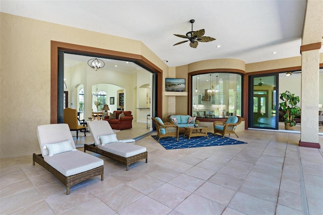 interior space featuring an outdoor living space and ceiling fan