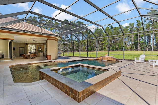 view of swimming pool with a lawn, a lanai, a ceiling fan, and a patio area