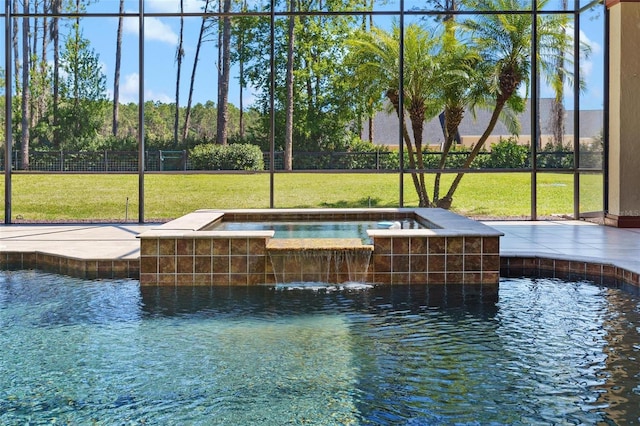 exterior space featuring a lawn, a hot tub, and fence