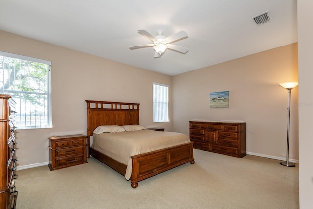 bedroom with baseboards, visible vents, ceiling fan, and carpet flooring