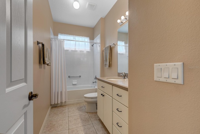 bathroom with tile patterned flooring, toilet, visible vents, vanity, and shower / bath combo