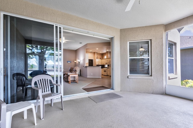 interior space featuring ceiling fan