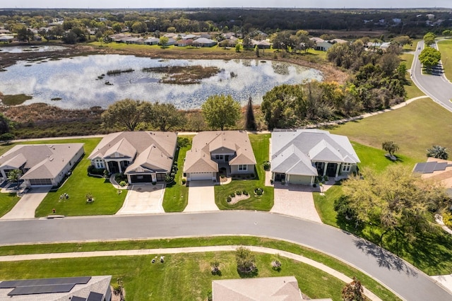 birds eye view of property with a water view and a residential view