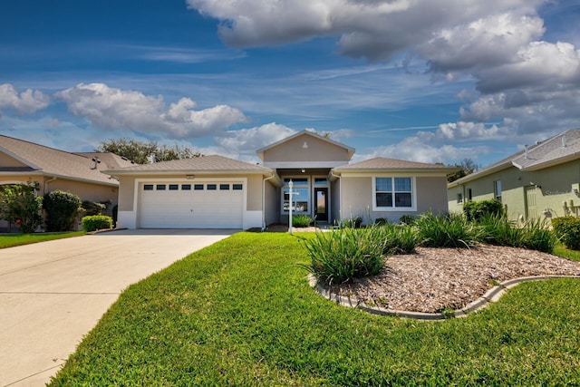 ranch-style home featuring a garage, a front yard, concrete driveway, and stucco siding