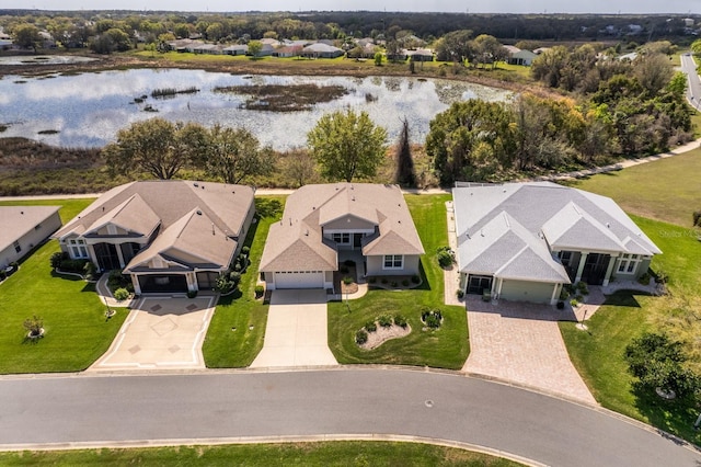 birds eye view of property featuring a residential view and a water view