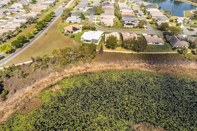 birds eye view of property featuring a water view and a residential view