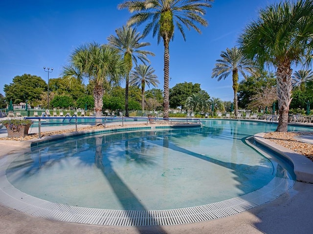 community pool featuring fence