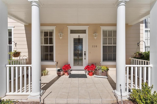 doorway to property with a porch