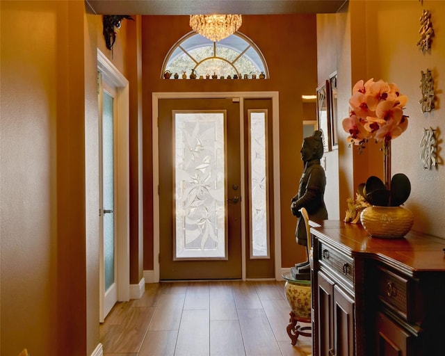 entryway featuring an inviting chandelier