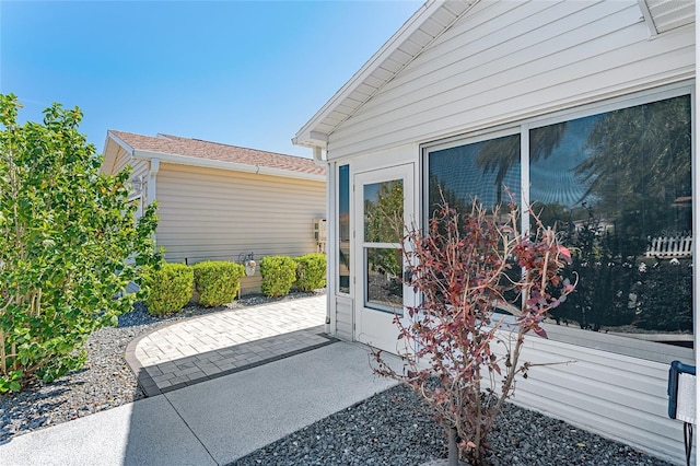 doorway to property with a patio