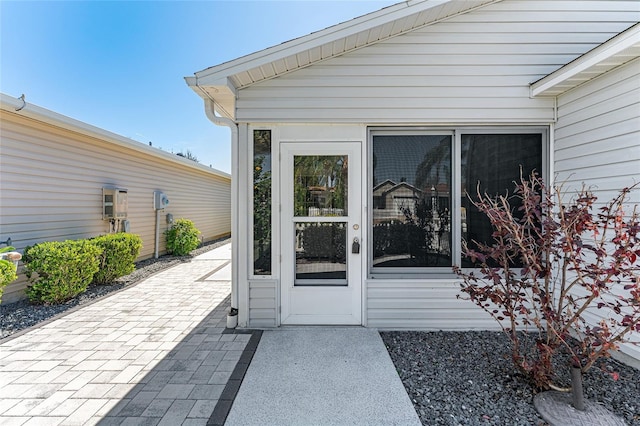 entrance to property featuring a patio area