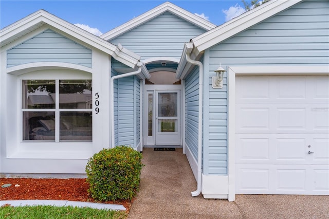 entrance to property with an attached garage