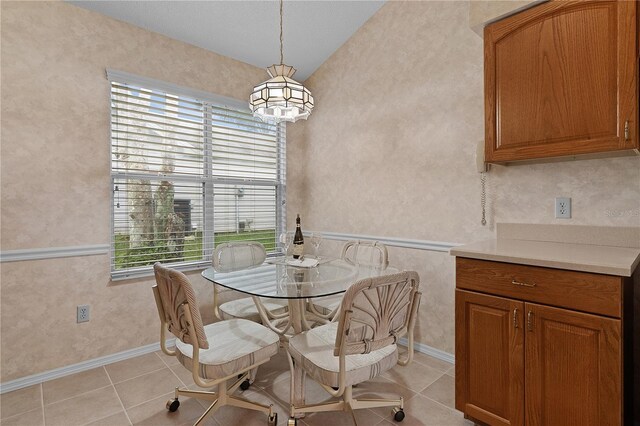 dining area featuring light tile patterned flooring