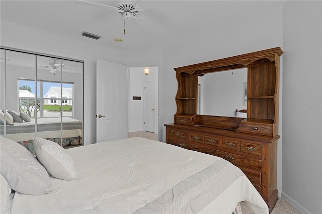 bedroom featuring baseboards, access to outside, visible vents, and a ceiling fan