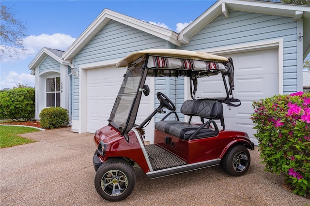 garage featuring driveway