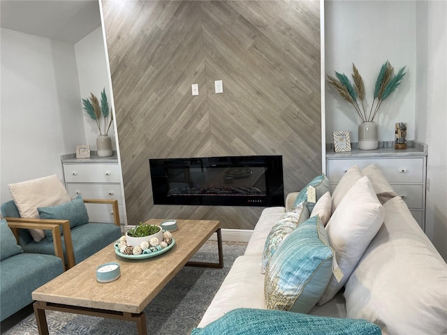 living area featuring a glass covered fireplace