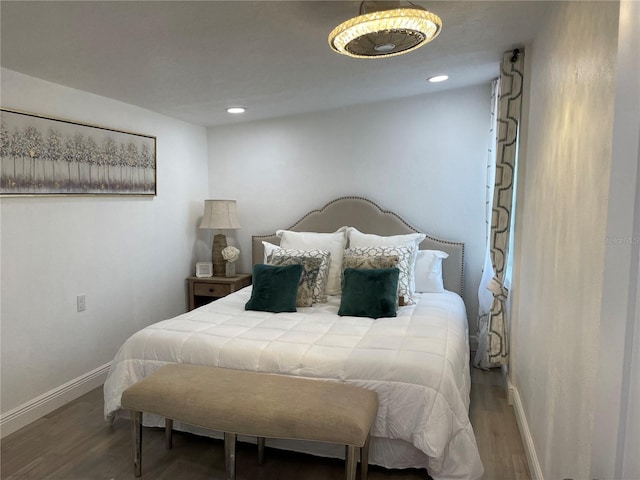 bedroom featuring recessed lighting, wood finished floors, and baseboards