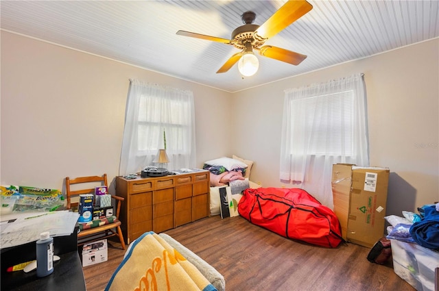 bedroom with wood finished floors and a ceiling fan