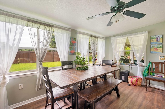 sunroom featuring vaulted ceiling and plenty of natural light