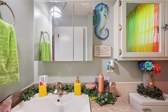 bathroom featuring a sink and toilet