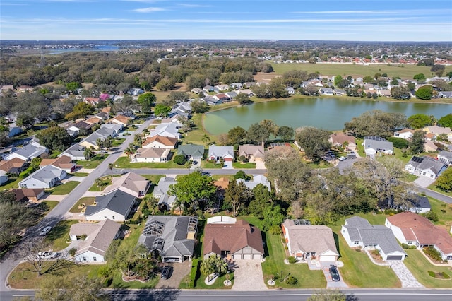 drone / aerial view featuring a residential view and a water view