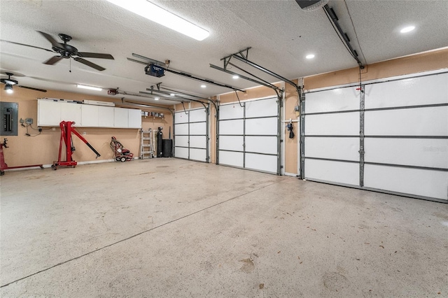 garage featuring electric panel and a garage door opener