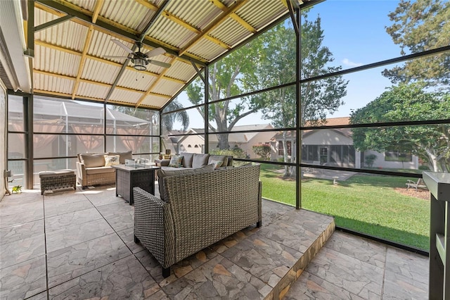 sunroom with vaulted ceiling and a ceiling fan