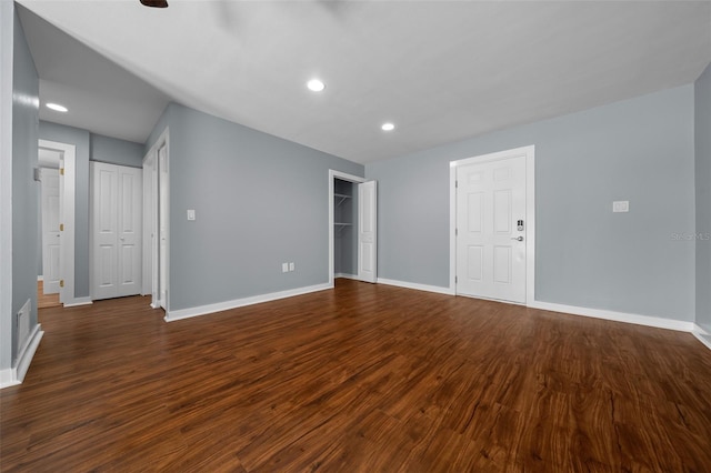 unfurnished room with recessed lighting, baseboards, and dark wood-style flooring