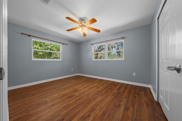 unfurnished bedroom with visible vents, baseboards, ceiling fan, dark wood-style floors, and a closet