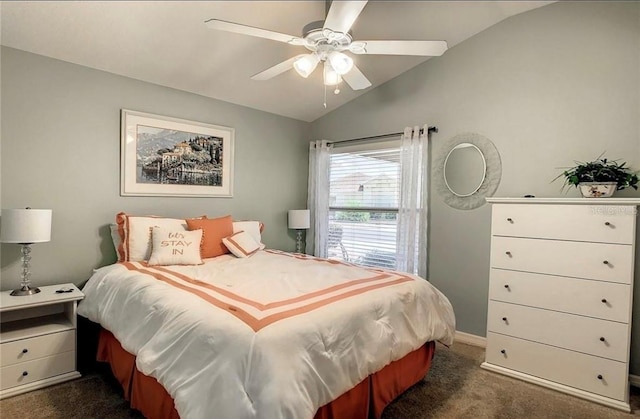 bedroom with vaulted ceiling, ceiling fan, dark carpet, and baseboards