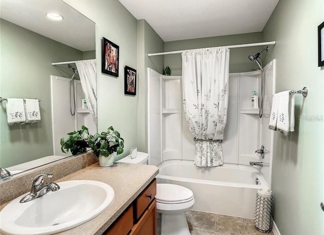 bathroom featuring toilet, shower / bath combo, tile patterned flooring, and vanity