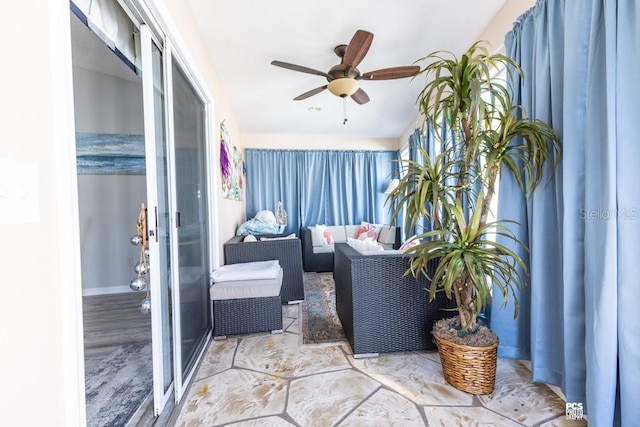 sunroom with a ceiling fan