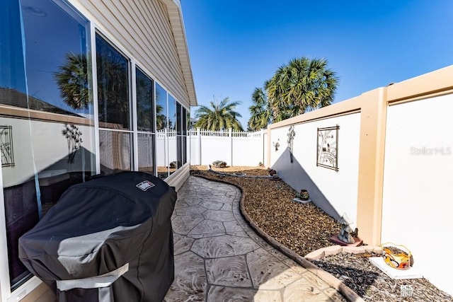 exterior space with a fenced backyard and a patio