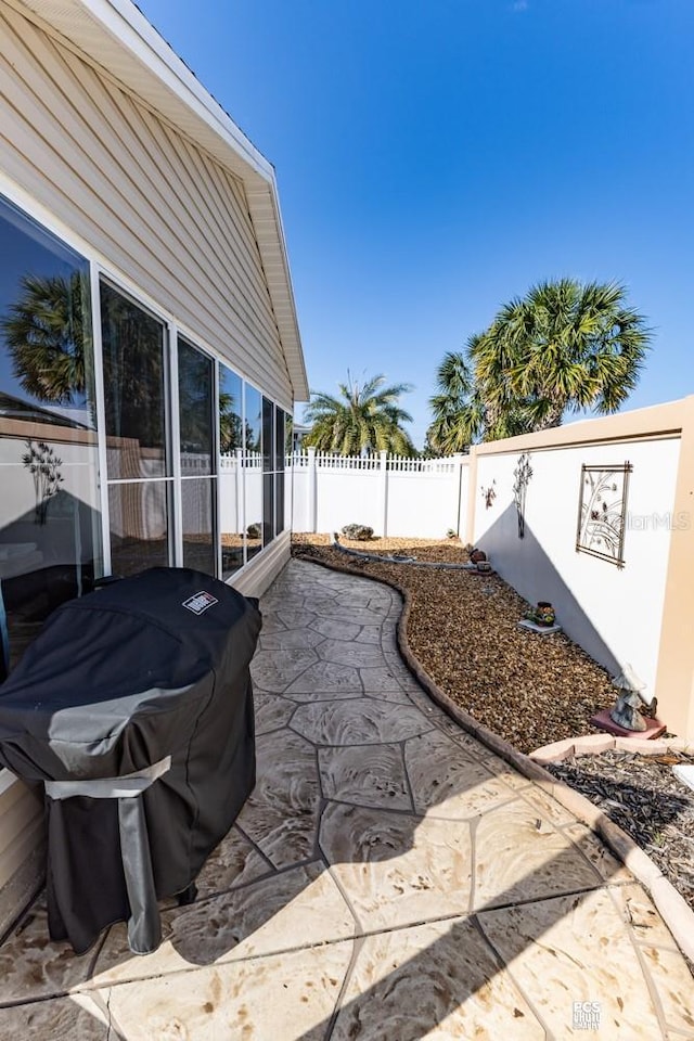 view of yard with a patio area and a fenced backyard