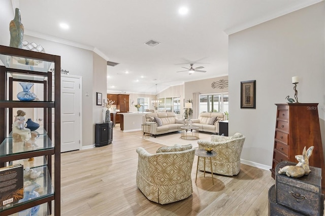 living area with baseboards, visible vents, ornamental molding, light wood-type flooring, and recessed lighting