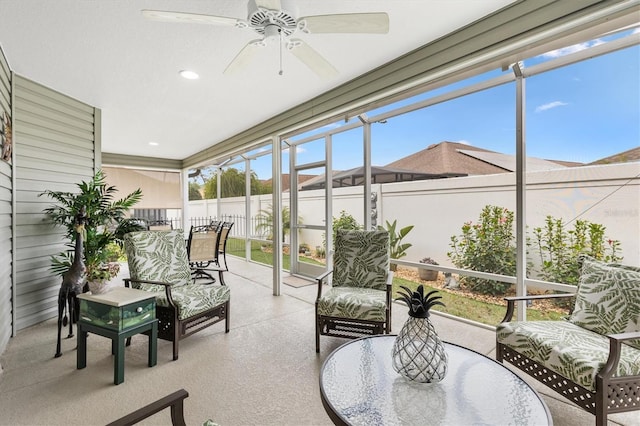 sunroom / solarium with ceiling fan